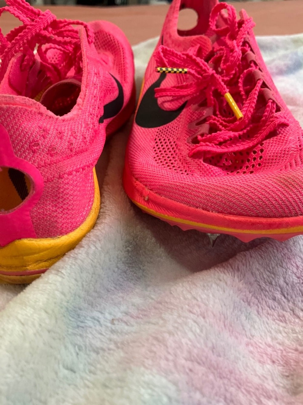 Pink track spikes